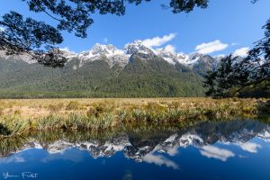 Snow-capped mountains reflection in the Mirror Lakes in New Zealand